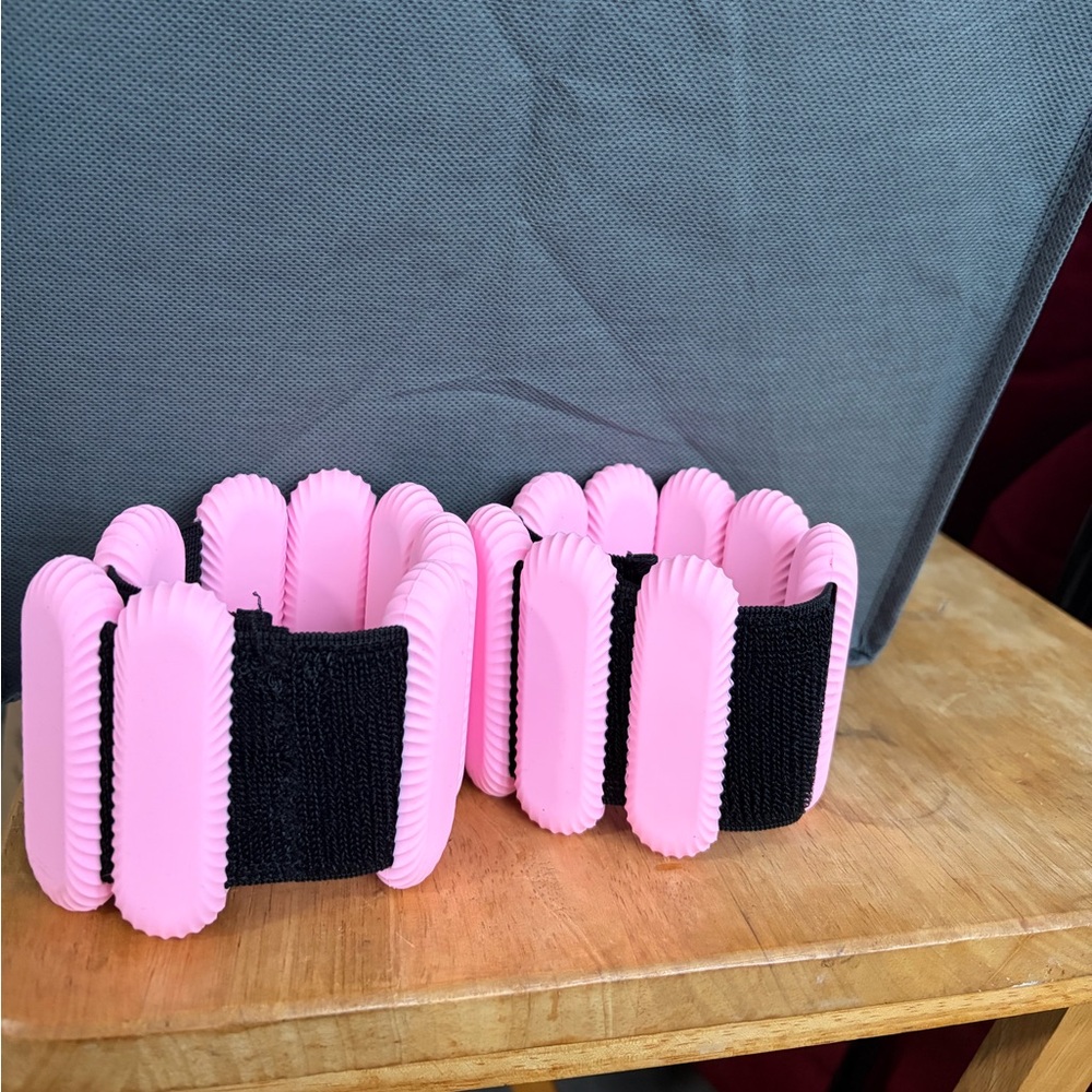 Pink & Black Stretch weights for ankles/wrists. 1 pound each. Totaling 2 lbs.